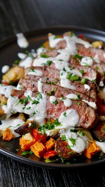 Seared NY Strip Steak over a Roasted Brussels Sprouts & Sweet Potato Hash topped with a Creamy Horseradish Sauce! 🥩🔥